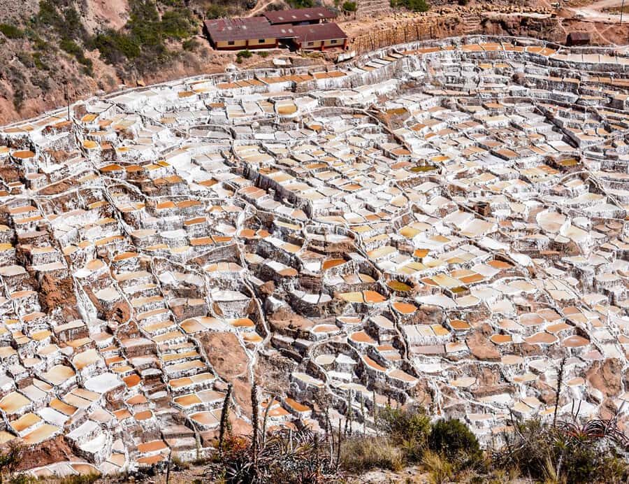 From Cusco: Moray, Maras Salt Mines & Chinchero Weavers Tour - Maras village: colonial stonework and a quick cultural pause